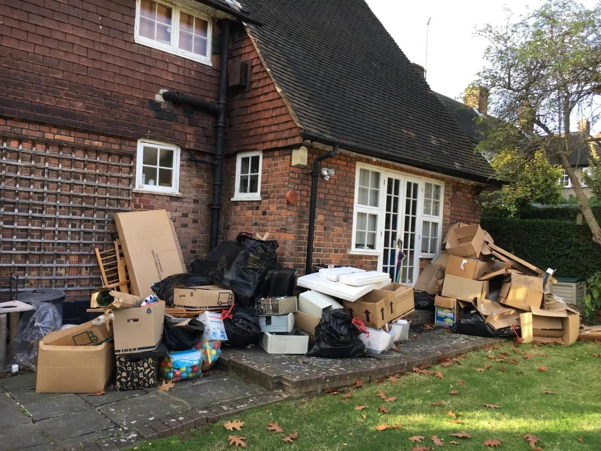 Items stacked outside a house ready for clearance