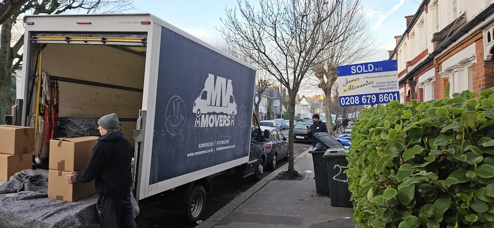 MV Movers Luton van outside a sold terraced house in West London