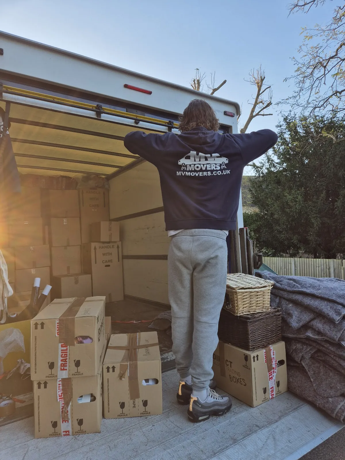 MV Movers crew member with packed boxes stacked ready for the van
